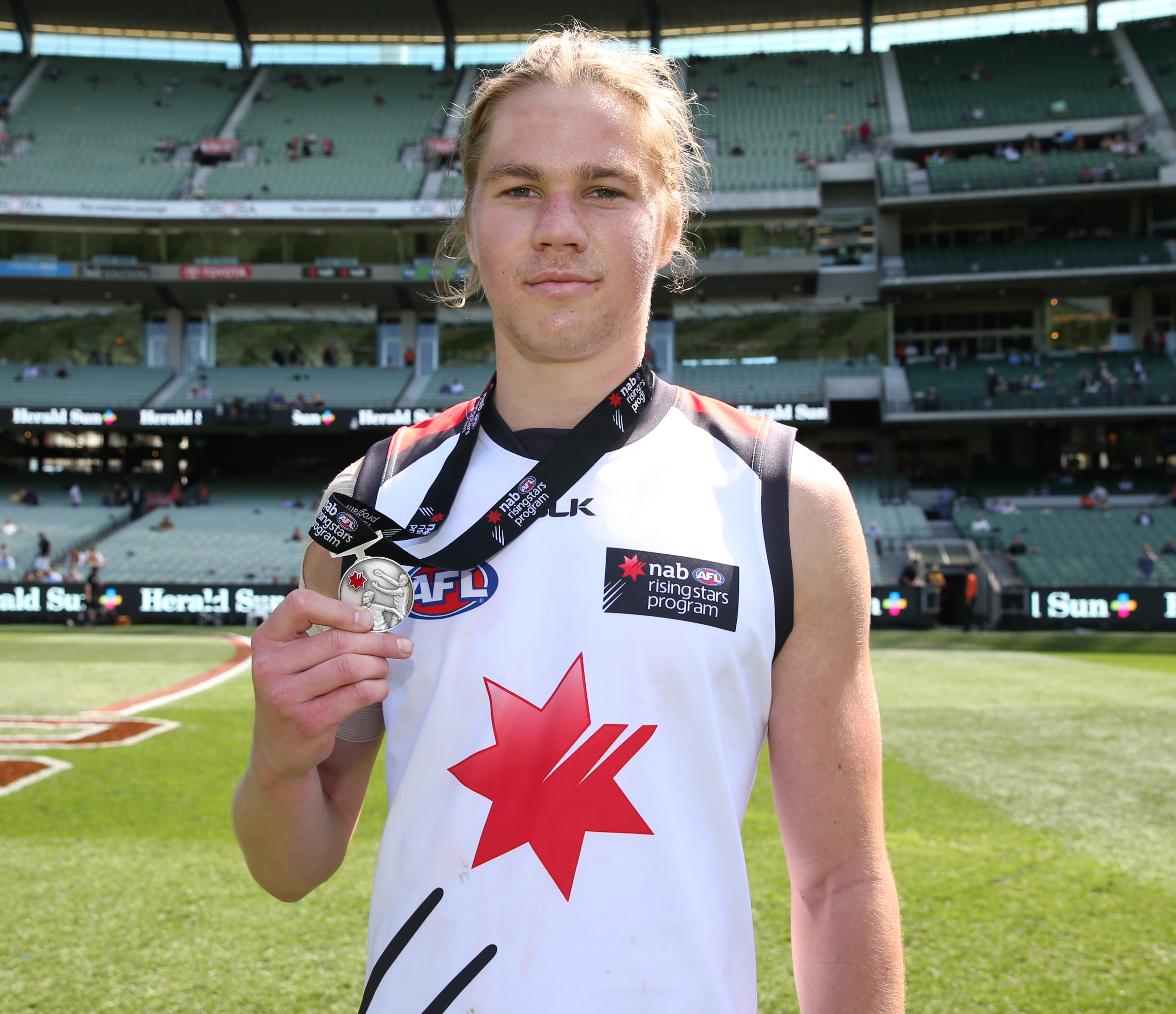Harrison Himmelberg poses with his medal for best afield. (Photo by Adam Trafford/AFL Media)